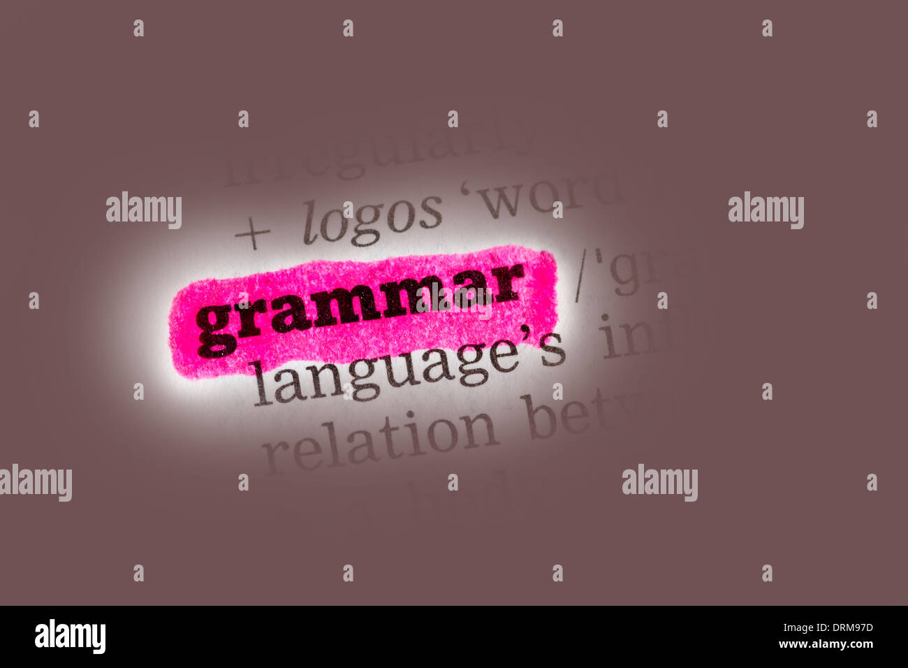 Grammar Dictionary Definition closeup highlighted in pink Stock Photo