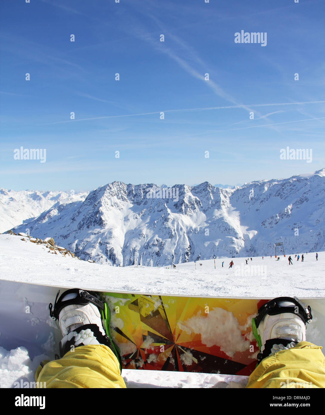 snowboarder sitting on snow Stock Photo