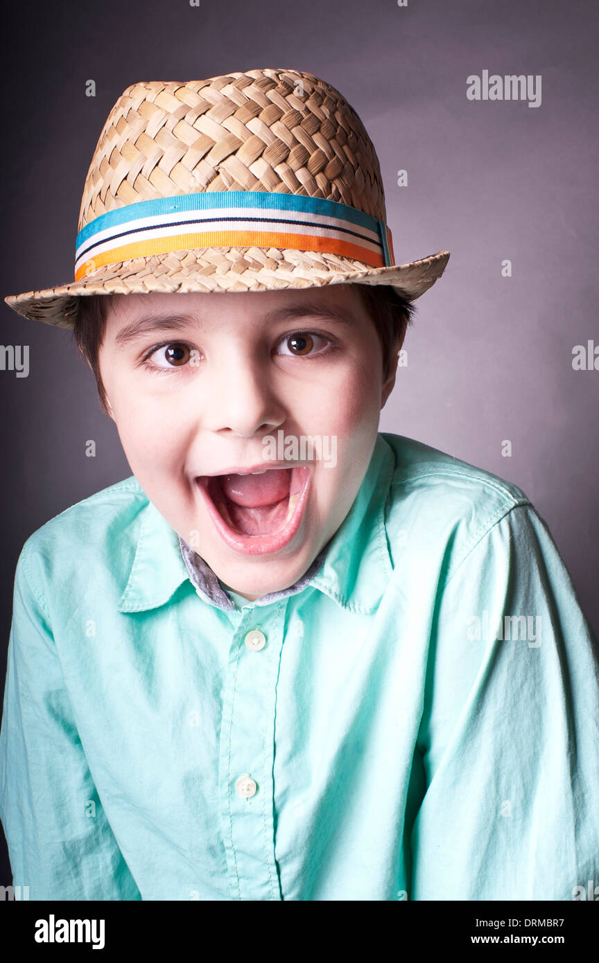 portrait of a shouting boy in a hat Stock Photo