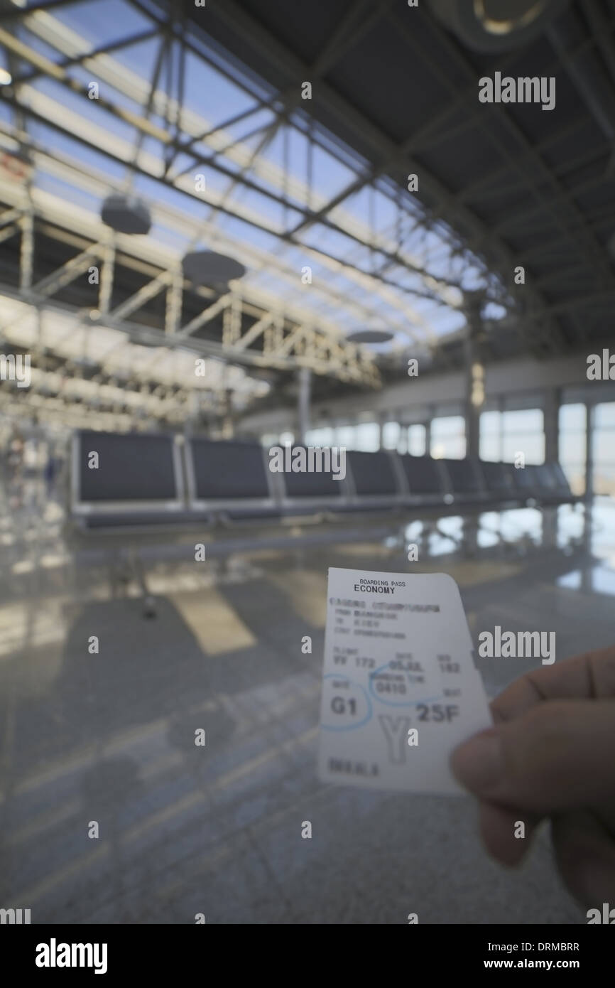 holding boarding card in airport Stock Photo Alamy