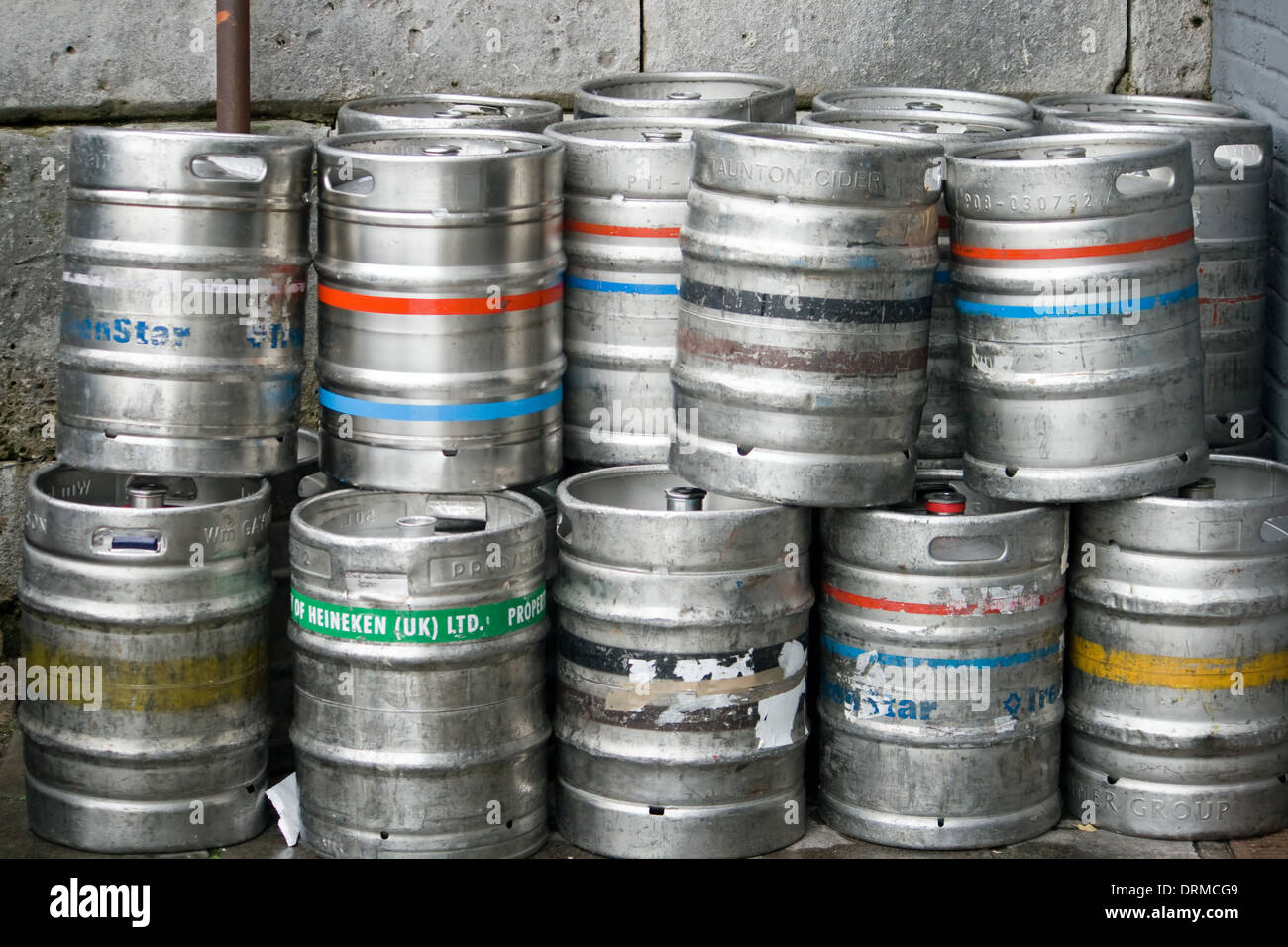 Stack of empty beer kegs outside a pub in Weymouth,Dorset,UK Stock Photo