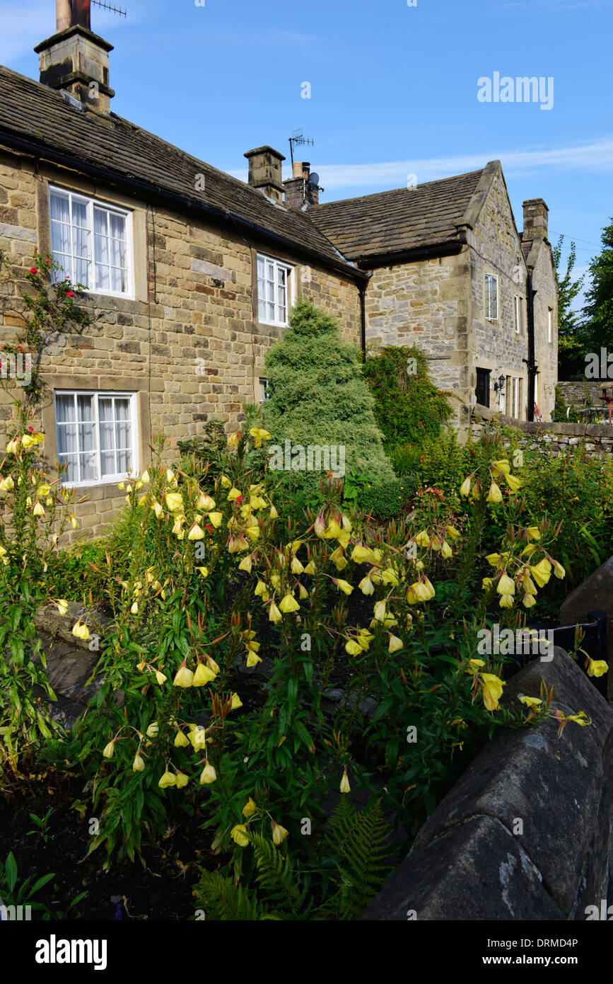 Front of stone cottages in the historic plague village of Eyam in the Peak District Derbyshire England Stock Photo
