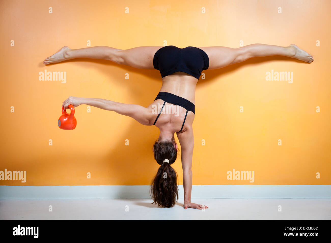 Gymnast performing exercises Stock Photo