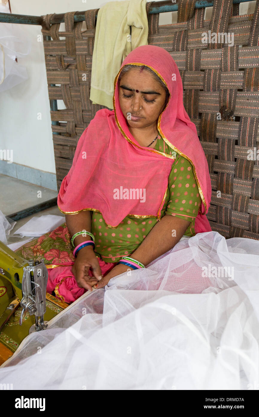 Disabled women sewing garments at the Barefoot College in Tilonia, Rajasthan, India Stock Photo