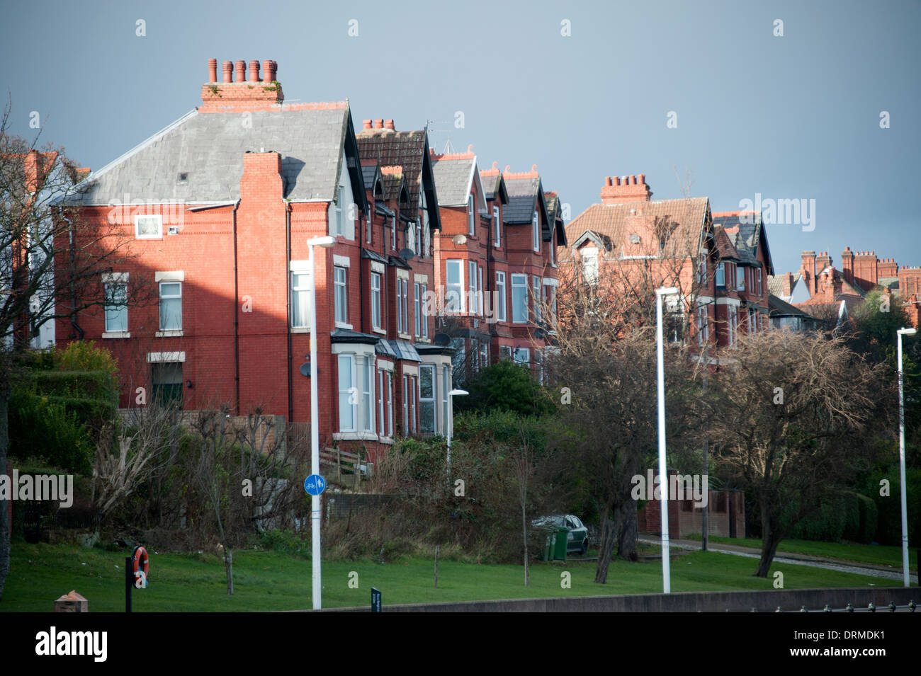 Large houses high up on embankment subsidence risk Stock Photo