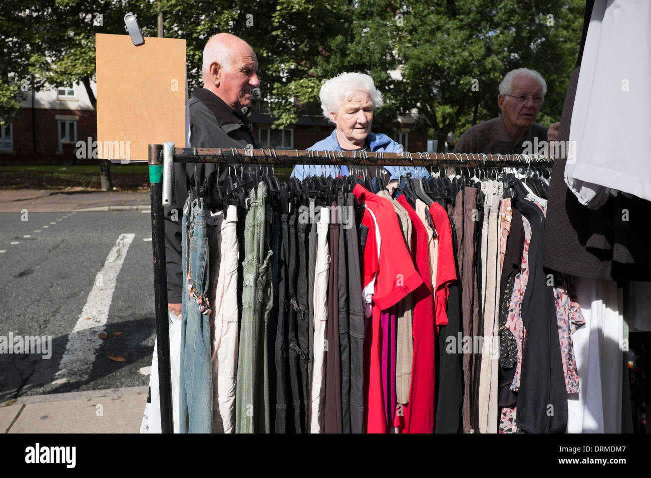 Old people clothes shopping market cheap clothing Stock Photo