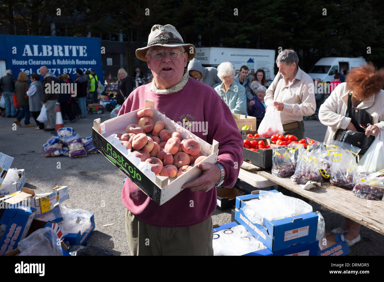 Market Stall Holder seller selling fruit & Veg Stock Photo