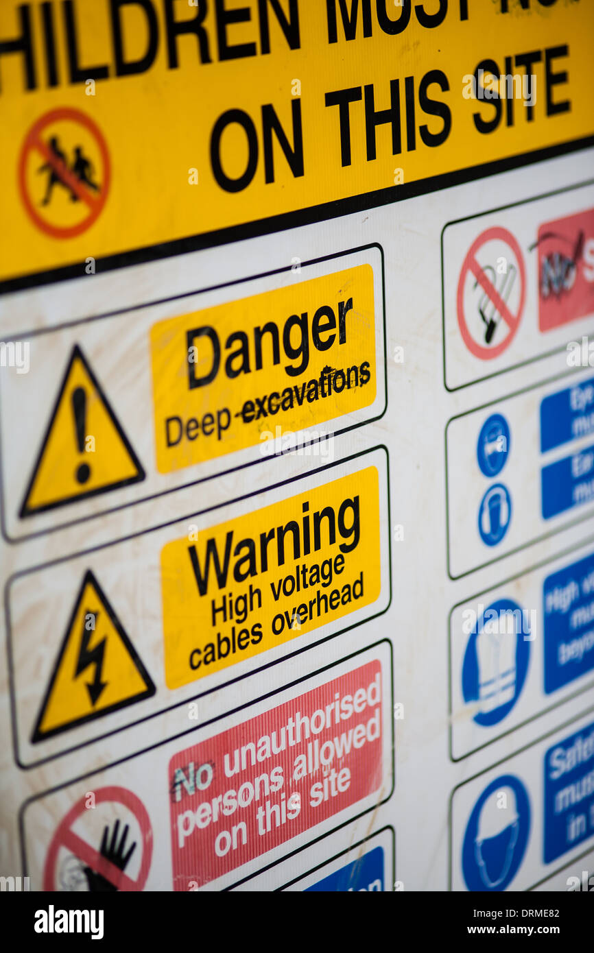 Health and safety warning signs at a building site entrance, Cornwall, UK Stock Photo