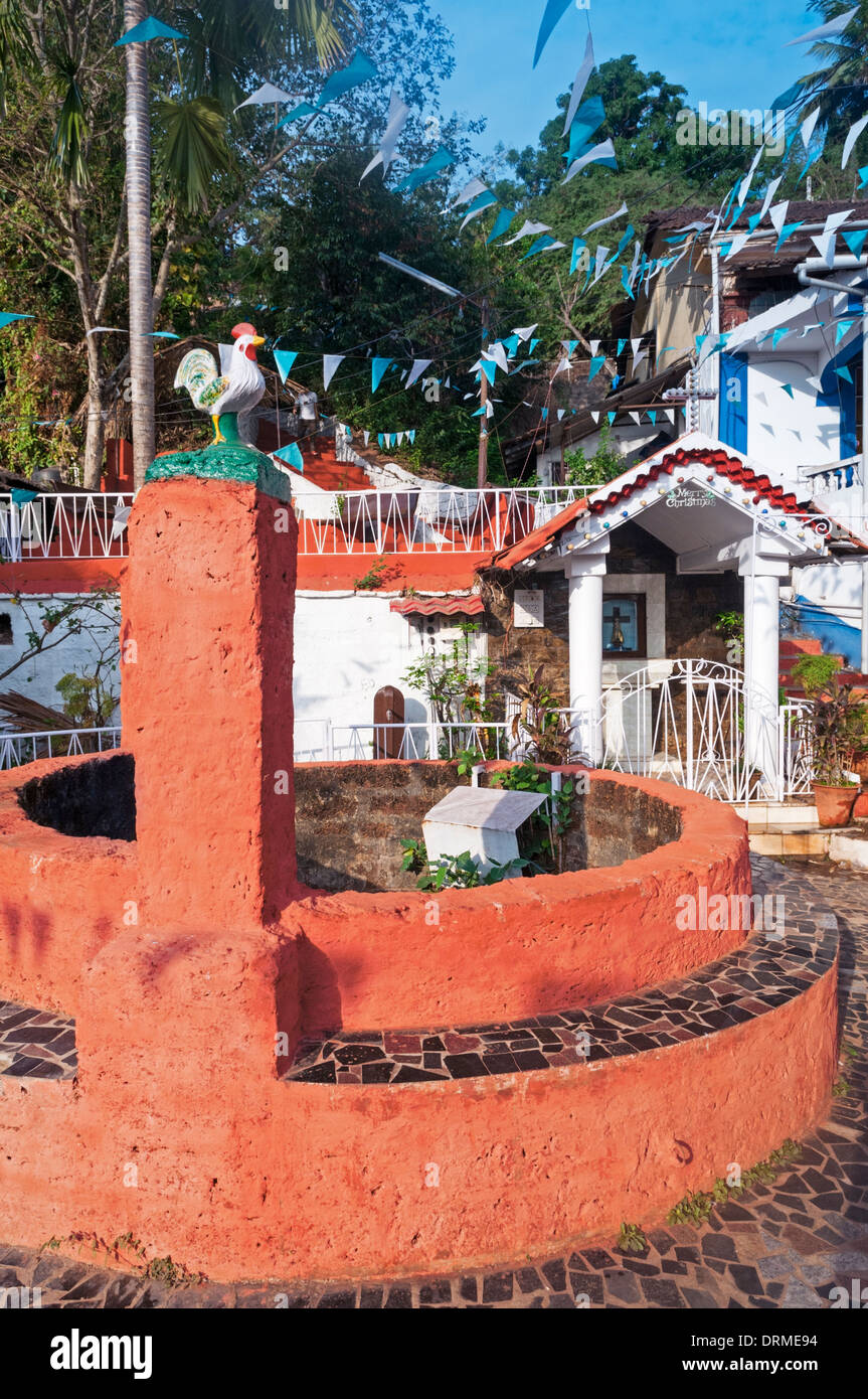 Old well and shrine Fontainhas quarter Panjim Tiswadi Goa India Stock Photo