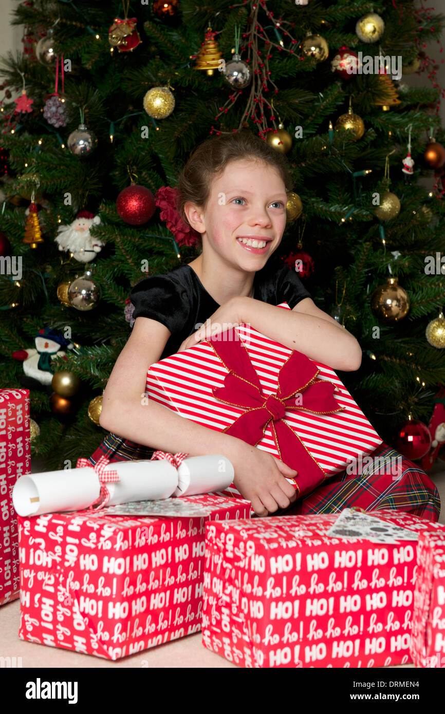 Girl opening Christmas Presents Stock Photo