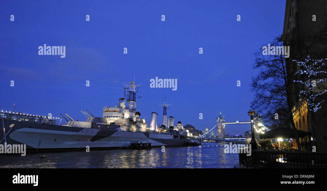 River Thames at dusk with HMS Belfast and Tower Bridge London England Stock Photo