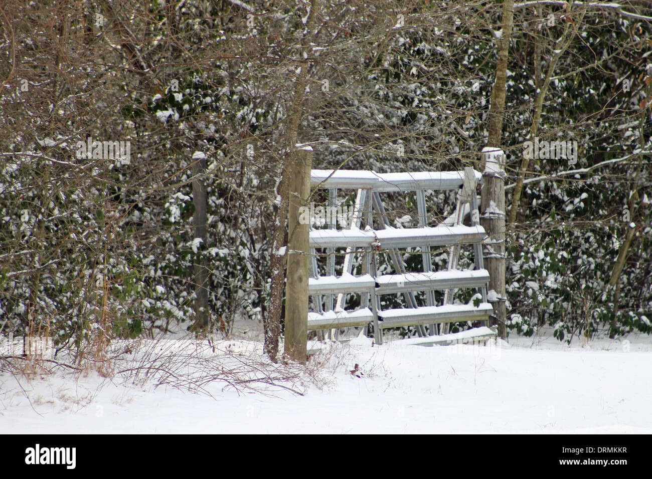 Snow falling on a gate Stock Photo