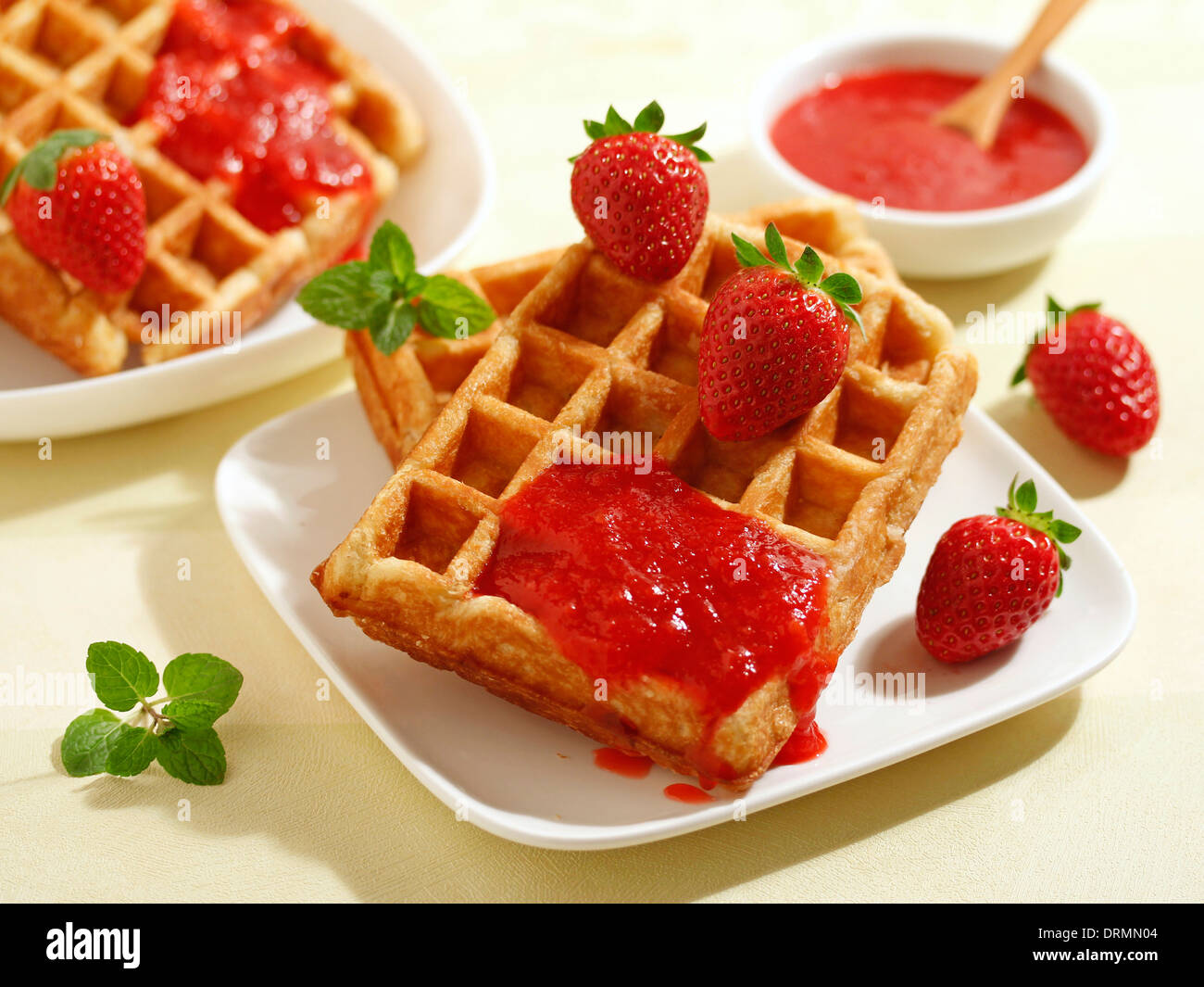 Waffles with strawberry jam. Recipe available. Stock Photo