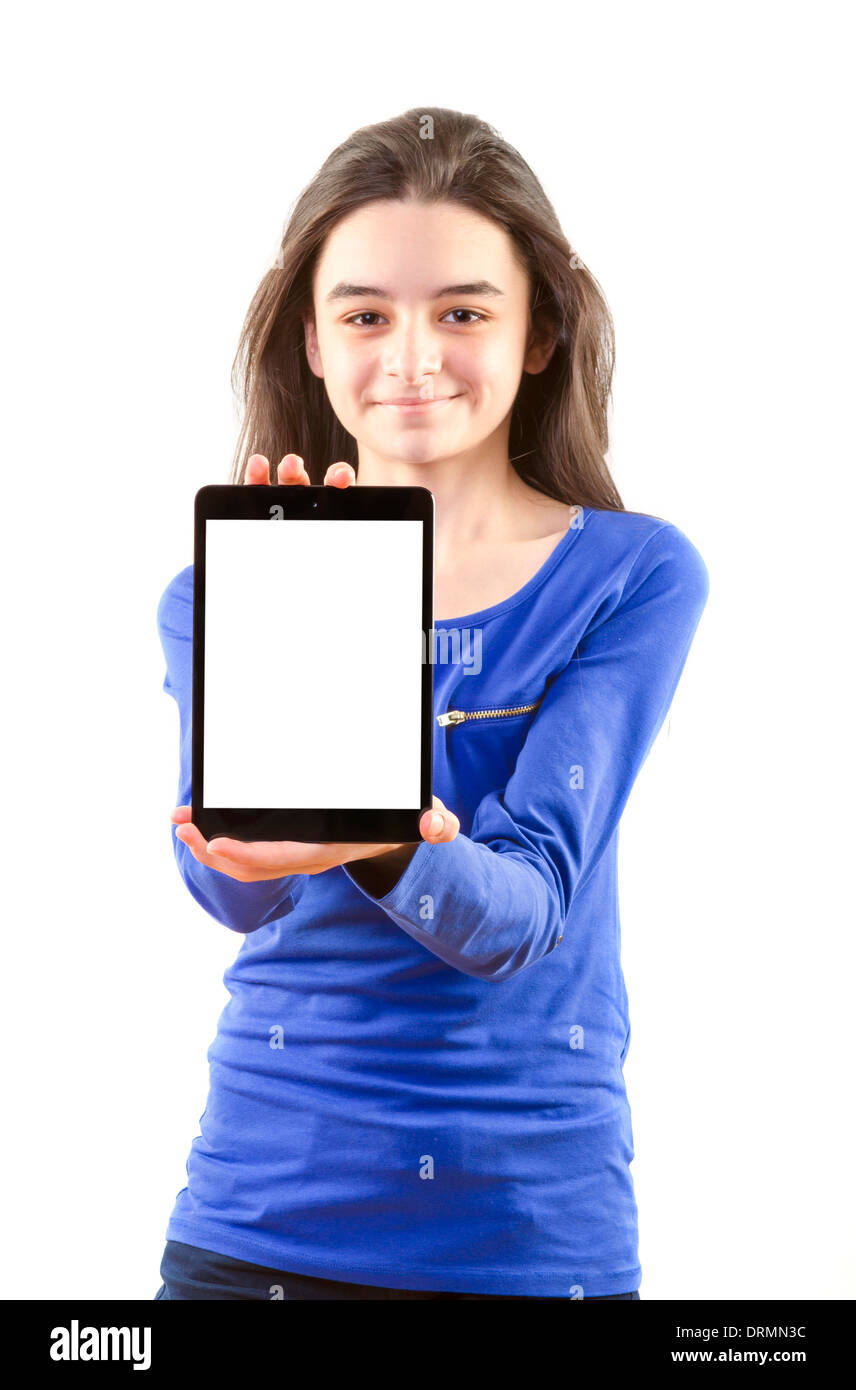 Happy teen girl show digital tablet on white background. Focus on tablet pc. Stock Photo