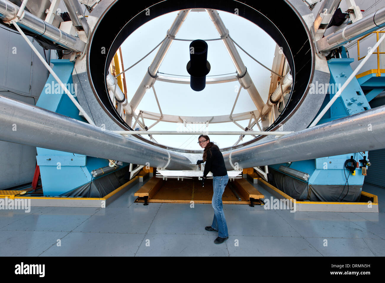 Operator adjusting 6.5m optical mirror, observatory, MMT. Stock Photo