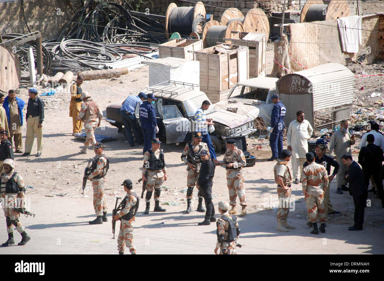 Karachi, Pakistan. 29th Jan, 2014. Views after hand IED blasts on rangers check post and van, as the rangers officials cordon off area and started search operation for detention of suspected persons, in Nazimabad area of Karachi on Wednesday, January 29, 2014. The first IED blast targeted a Rangers check post near the Matric board office. The second IED blast took place in the same spot a few minutes later claiming the life of personnel of the Rangers force. Five others including policemen and Rangers were also injured. Credit:  Asianet-Pakistan/Alamy Live News Stock Photo