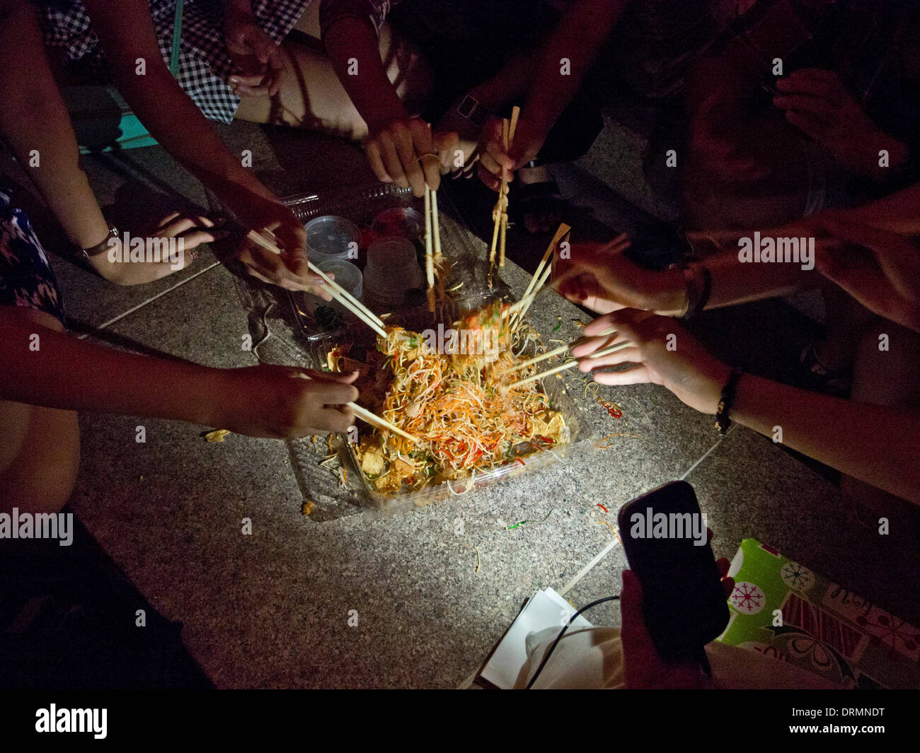 Singapore,29 January 2014. Traditional tossing of food during Chinese