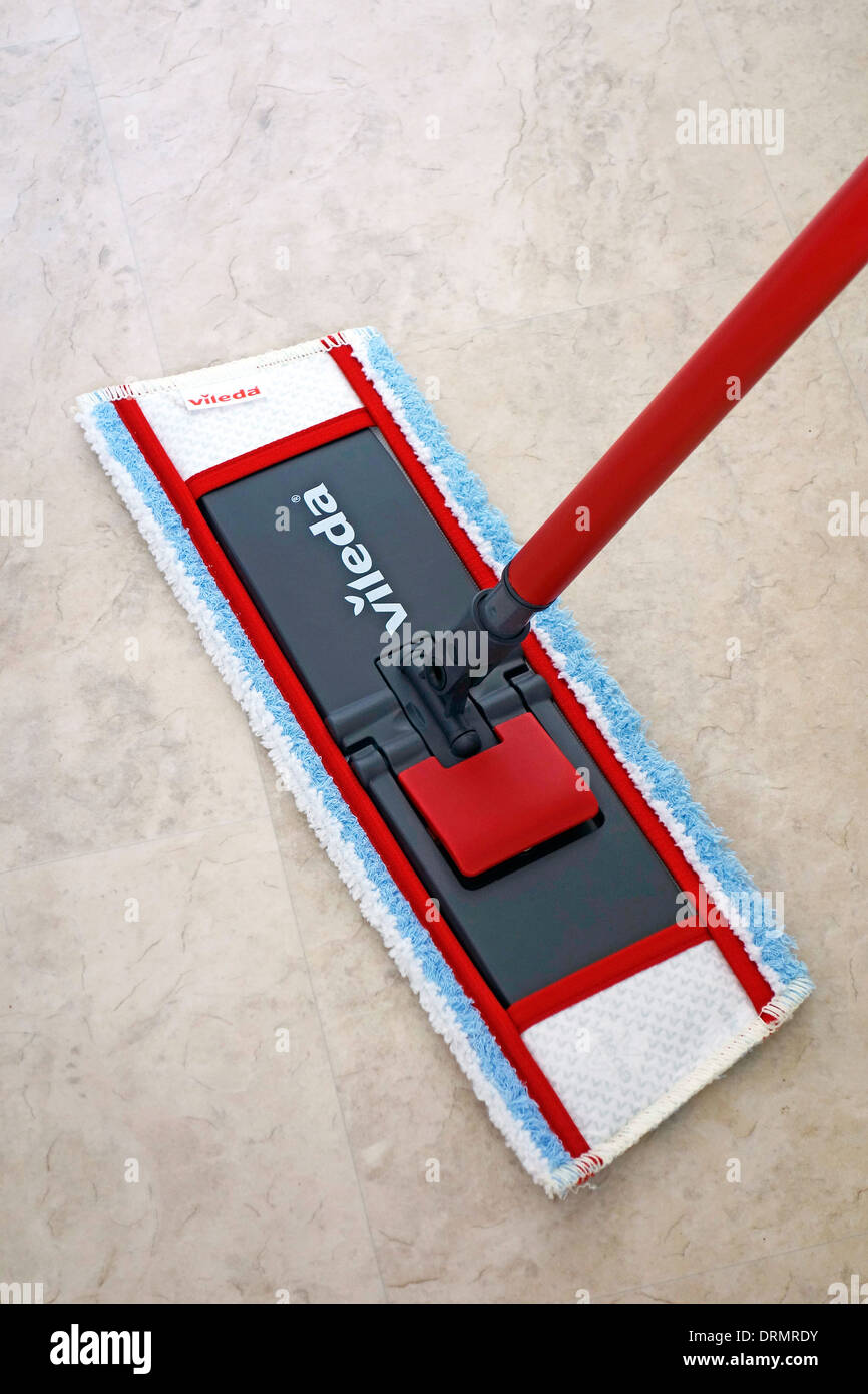 Vileda Mop Mopping a Marble Effect Vinyl Floor Stock Photo