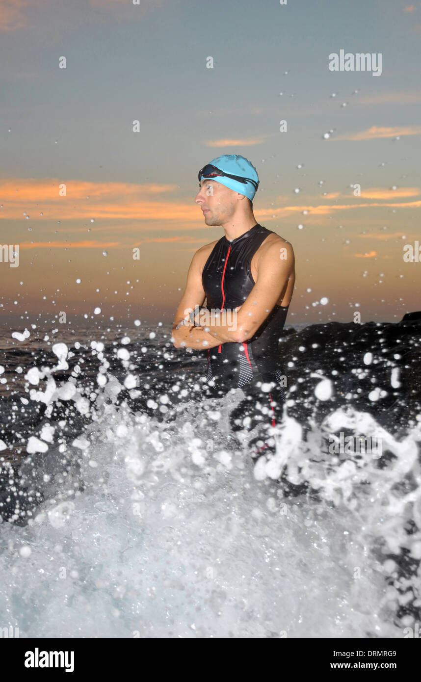 triathlon young athlete out of the sea at dawn Stock Photo