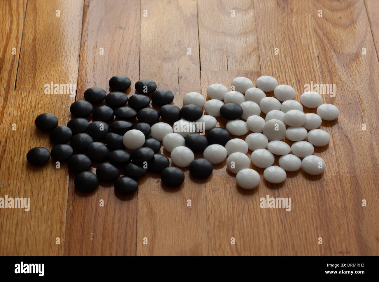 interaction between black and white game pieces Stock Photo Alamy