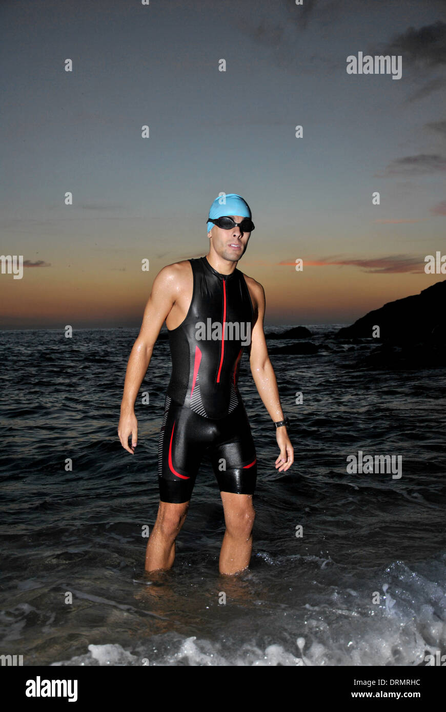 triathlon young athlete out of the sea at dawn Stock Photo