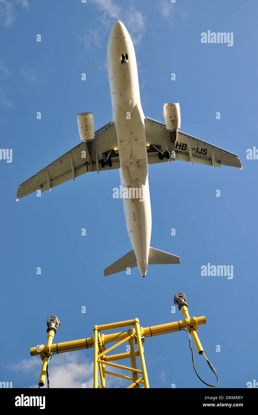 Swiss Int Airlines A320 HB-IJS flies over an Approach Lighting System at London Heathrow. ALS is a landing safety procedure aid. Jet airliner plane Stock Photo