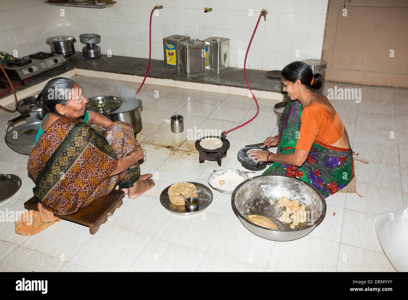 Cooking using biogas made on the premises at the Muni Seva Ashram in