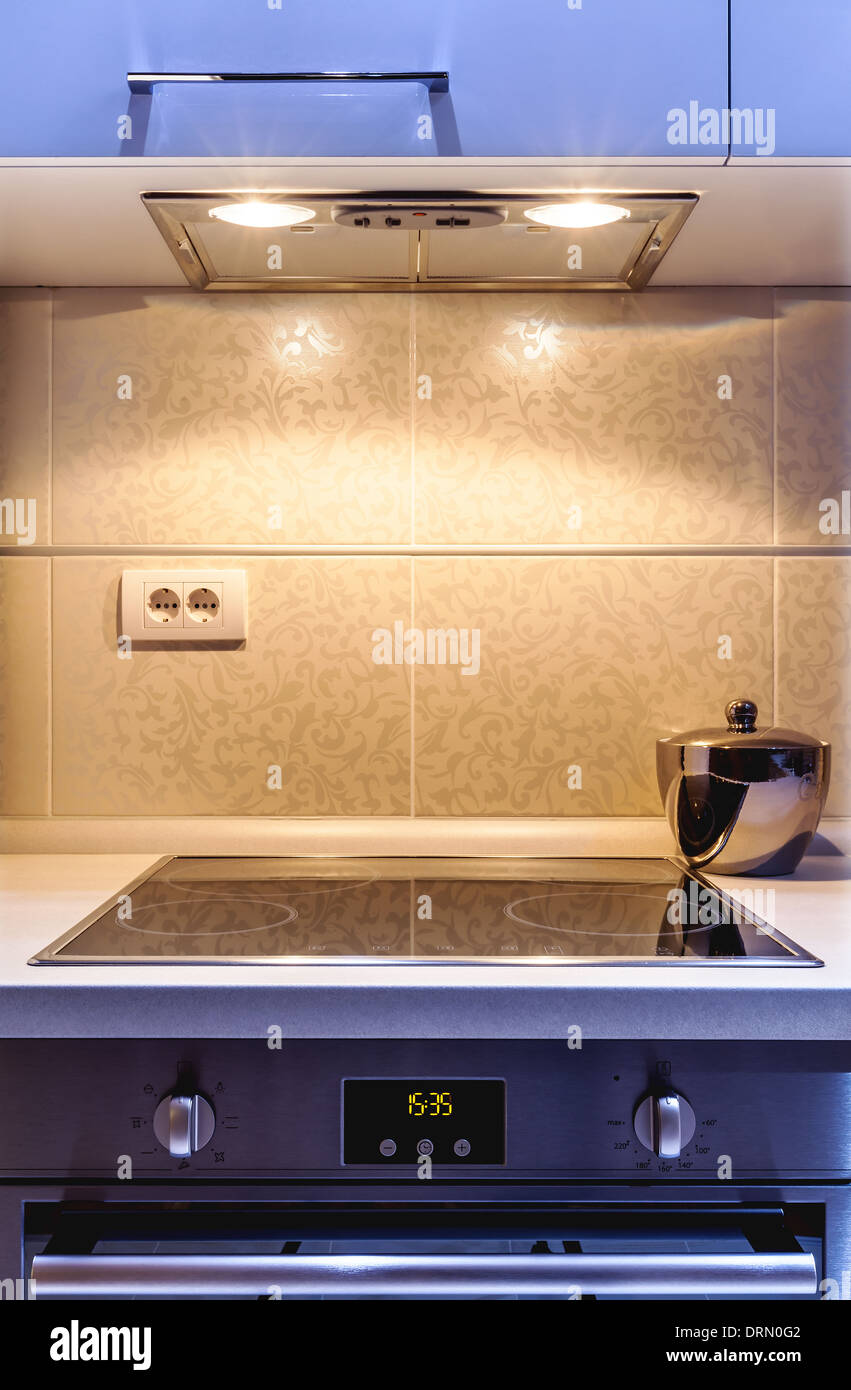 Part of a modern kitchen, electric stove details with aspirator Stock