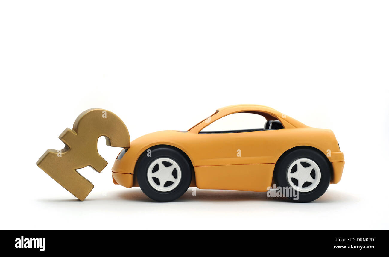 YELLOW CAR KNOCKING OVER BRITISH POUND SIGN RE INSURANCE POLICY MOTORING COSTS PRICES BUYING SELLING CARS NEW DEPRECIATION UK Stock Photo