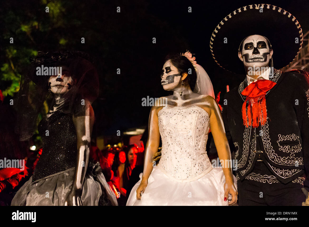 A group of young people disguised as skeletons appear in a performance about death. Stock Photo
