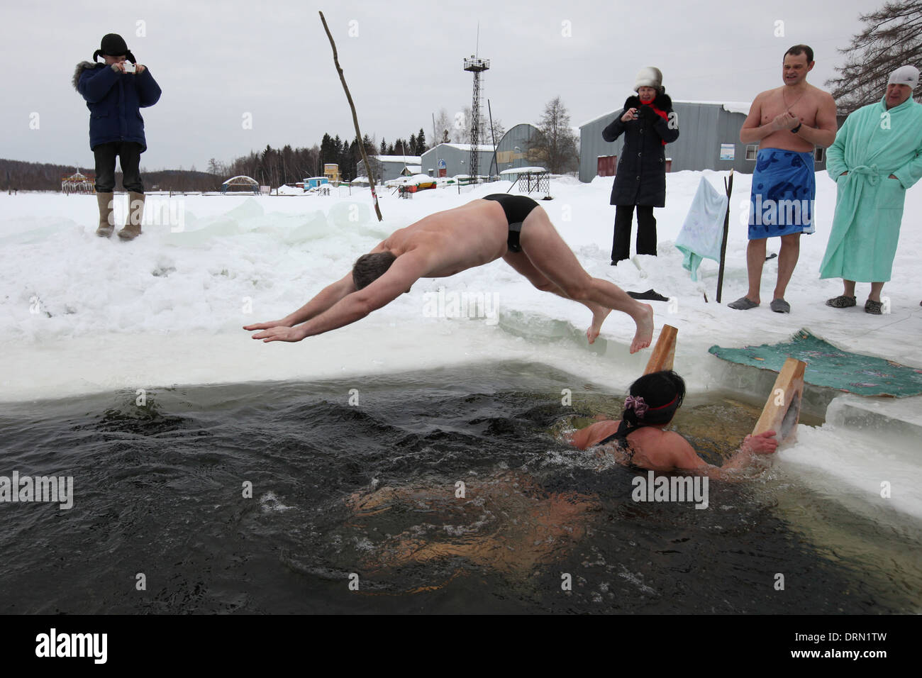 Competition in winter swimming in the Verkh-Neyvinsky Pond near the town of Novouralsk in the Urals Mountains, Russia. Stock Photo