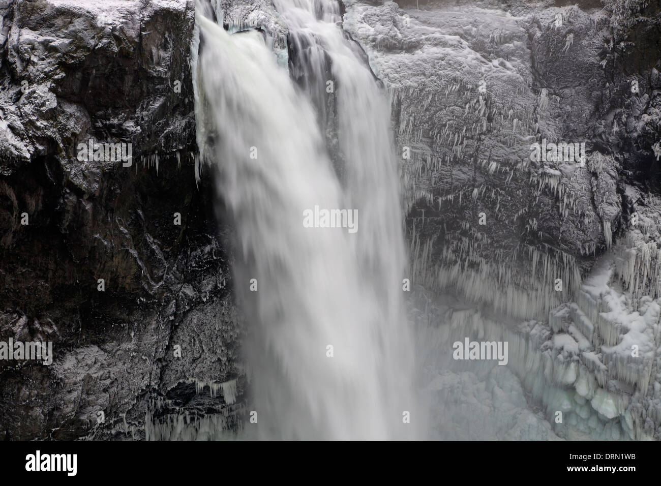 WASHINGTON - Frozen spray on the steep hillsides surrounding Snoqualmie Falls on the Snoqualmie River. Stock Photo