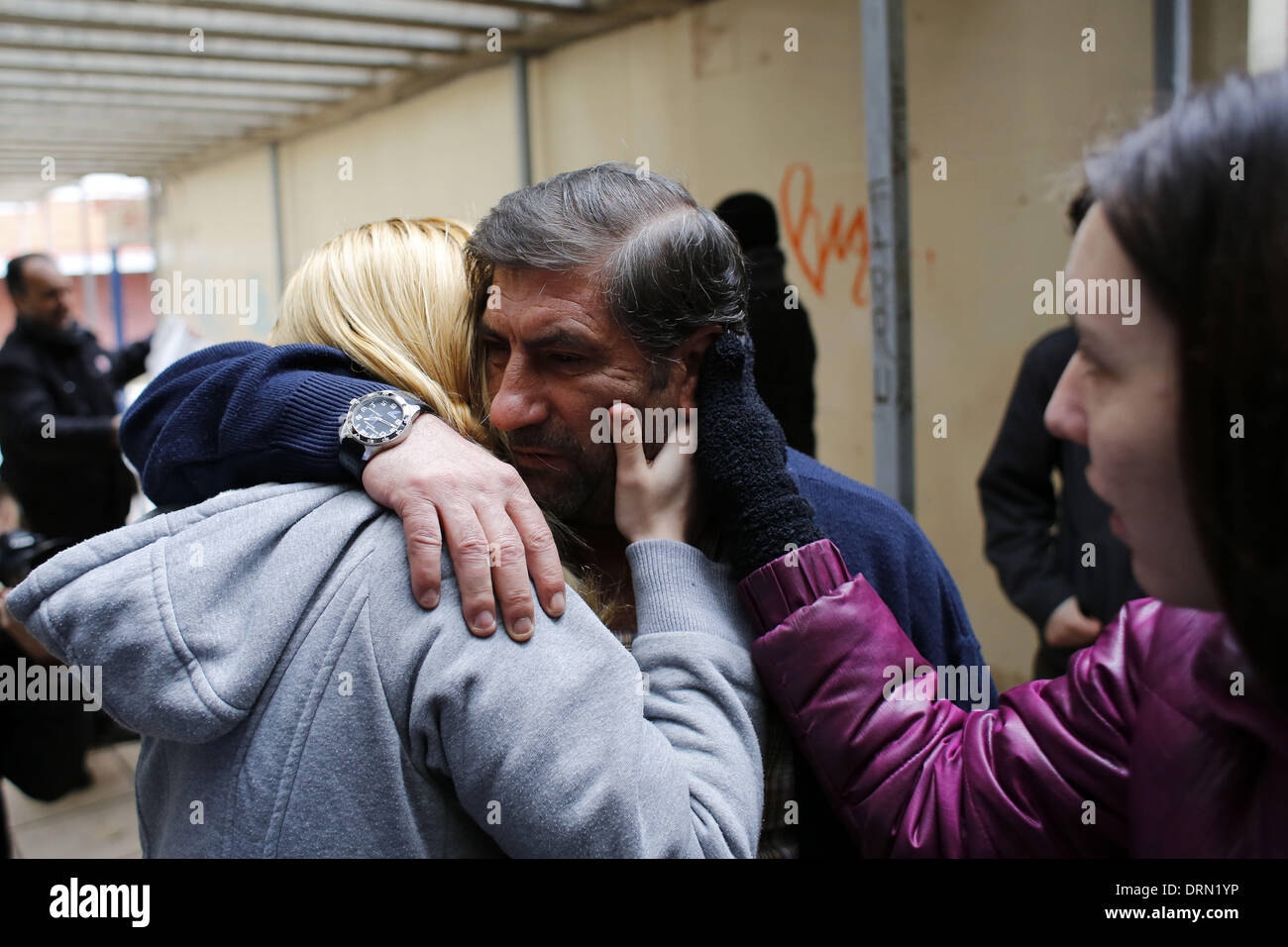 Madrid, Spain. 29th Jan, 2014. ANDRES GONZALEZ MANZANO, 52, (middle) reacts while hugging a neighbor from his building after finding that his eviction has been stopped for 40 days. Gonzalez is an ex-construction worker with a 33% disability living with his 21 year-old unemployed son. © Rodrigo Garcia/NurPhoto/ZUMAPRESS.com/Alamy Live News Stock Photo