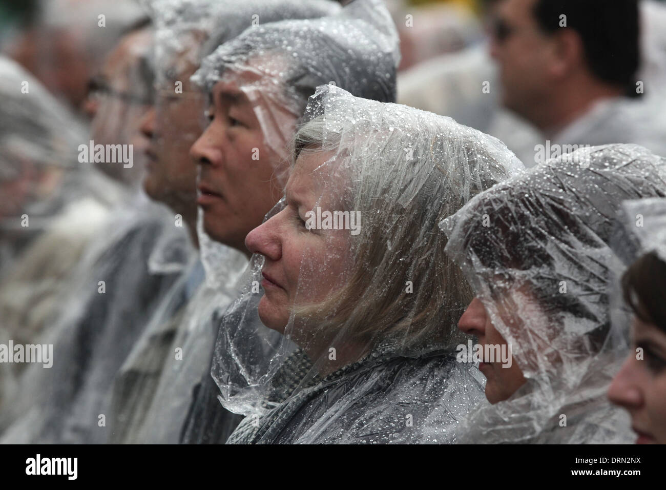 Foreigner diplomats wearing raincoats attend an orthodox service in honour of Saints Cyril and Methodius in Mikulcice. Stock Photo
