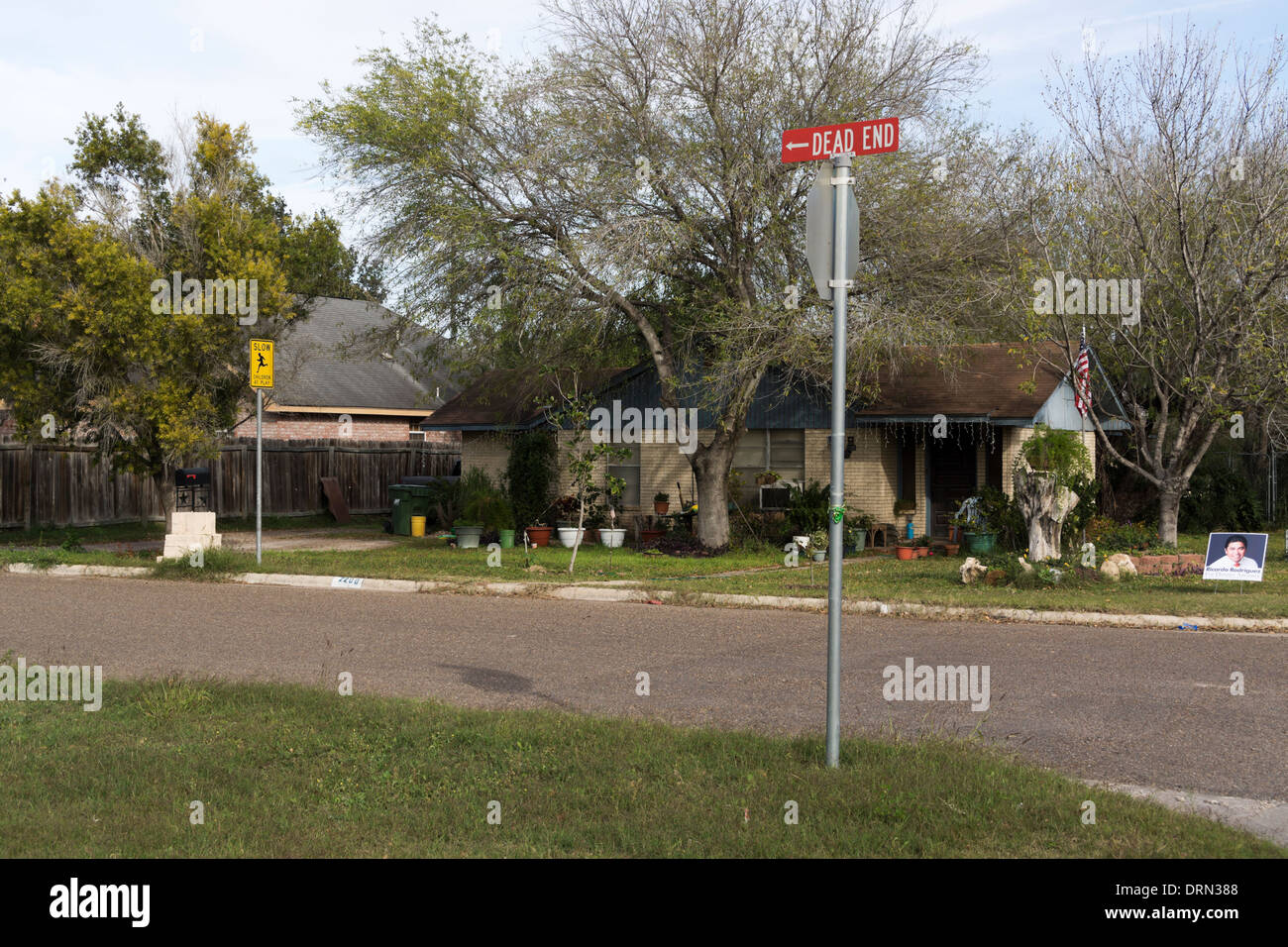 Neighborhood street signs: Slow, Children Playing and Dead End. Stock Photo