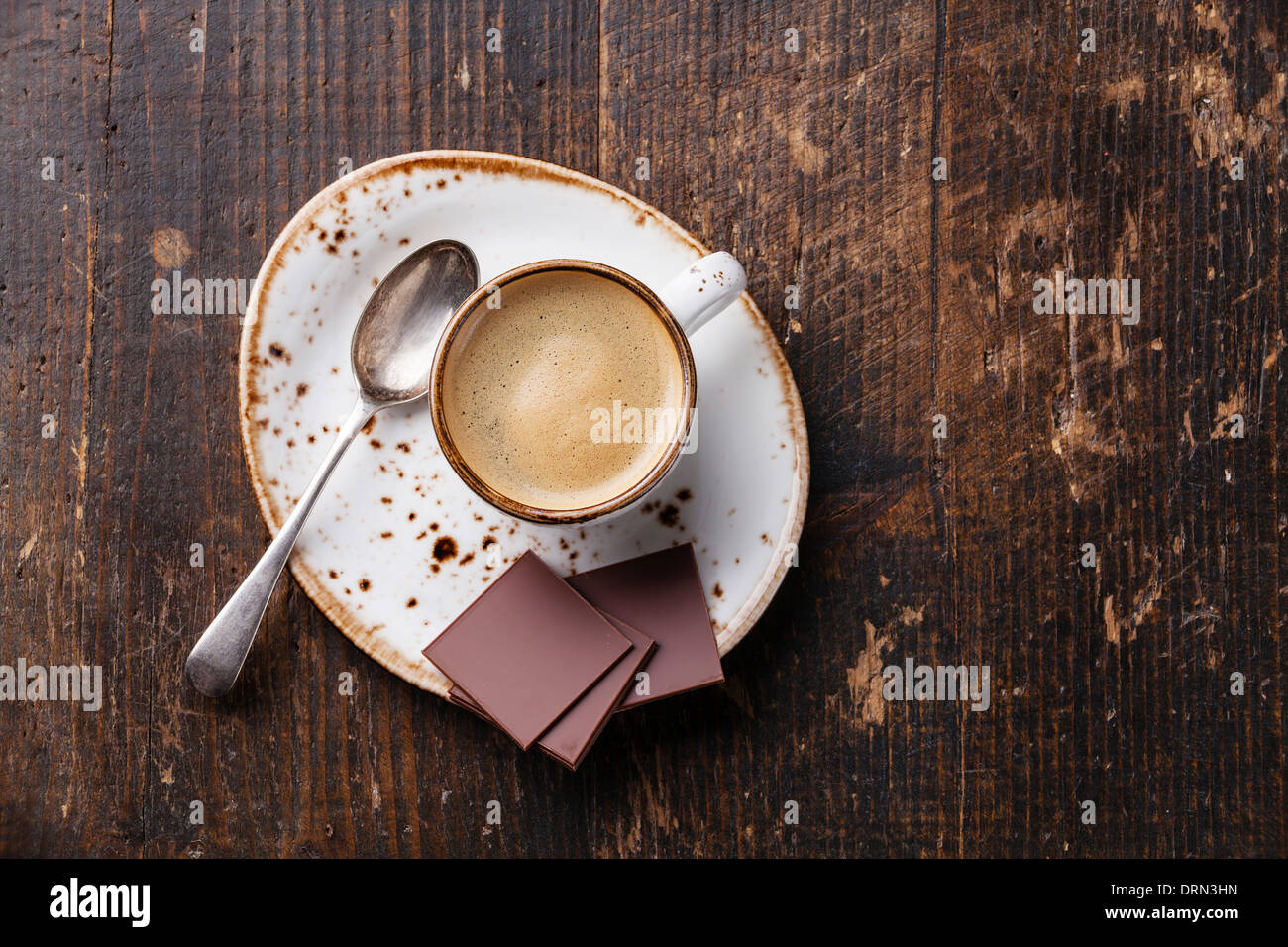 Espresso cup with chocolate on wooden background Stock Photo