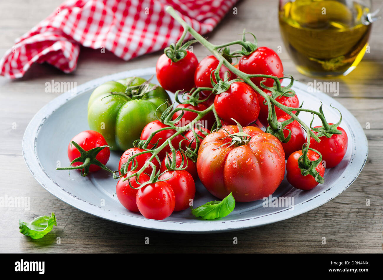 Fresh tomatoes with olive oil Stock Photo