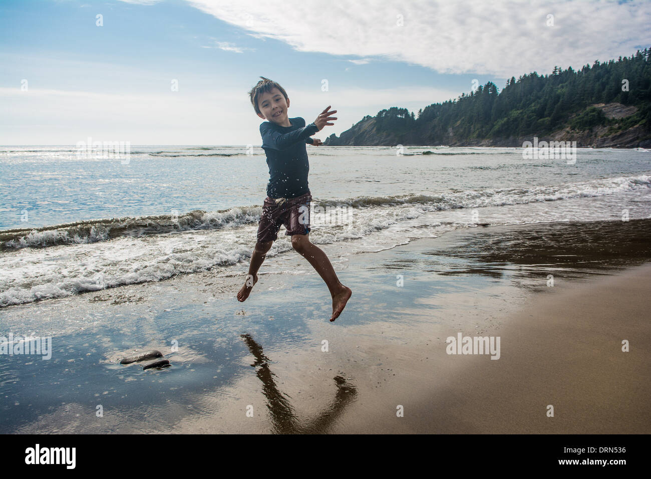 8 year old boy at the beach Stock Photo