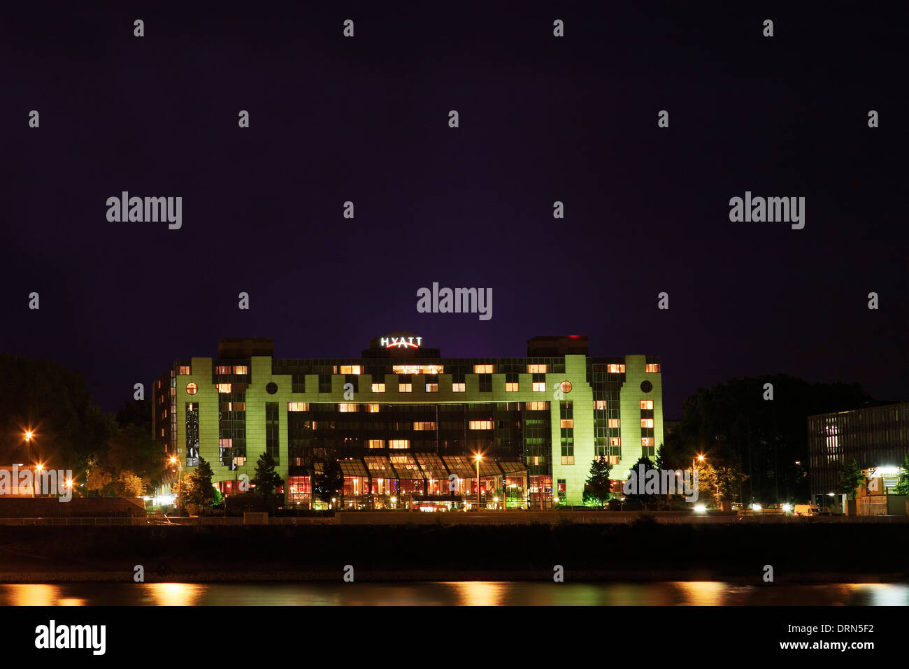 The illuminated Hyatt hotel building in Cologne at night, Germany. Stock Photo