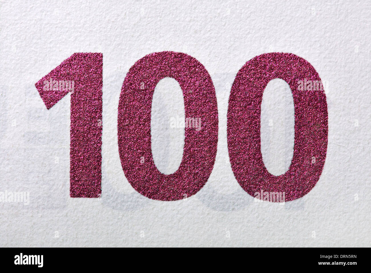 cypher one hundred, ruby colored, detail of an euro banknote. Stock Photo