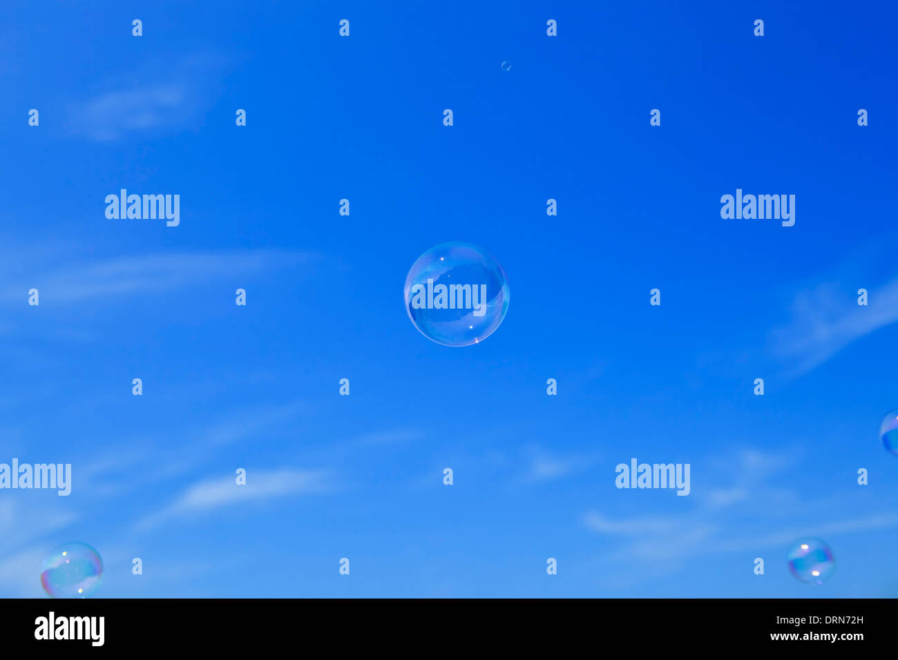 Soap bubbles floating in the blue sky Stock Photo