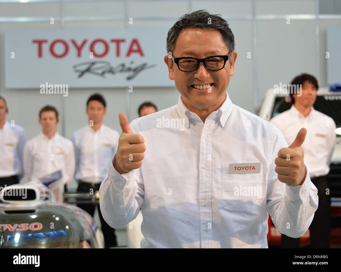 Tokyo, Japan. 30th Jan, 2014. President Akio Toyoda of Japan's Toyota Motor Corp., flashes the thumbs-up sign during a presentation of its motor sports activities for 2014 in Tokyo. They will include participation in the FIA World Endurance Championship and the Le Mans 24-hour race, the NASCAR racing series and the Super GT and Super Formula championships. Toyoda said its motor sports activities through Lexus Racing and Toyota Racing are aimed to bring more joy to more people through automobiles. Credit:  Natsuki Sakai/AFLO/Alamy Live News Stock Photo