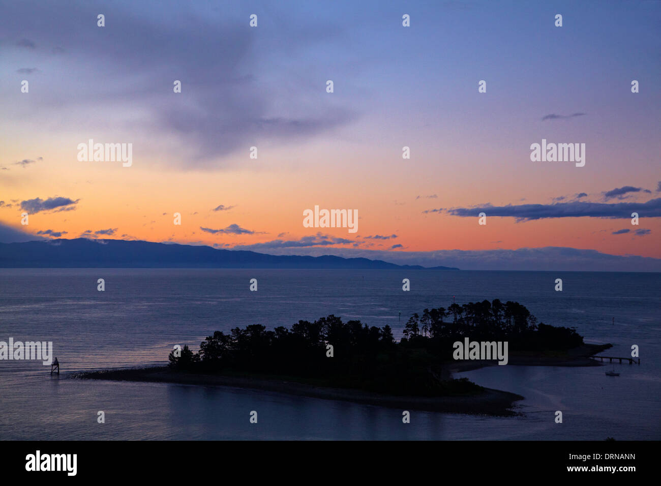 Haulashore Island and Tasman Bay at sunset, Nelson, South Island, New Zealand Stock Photo