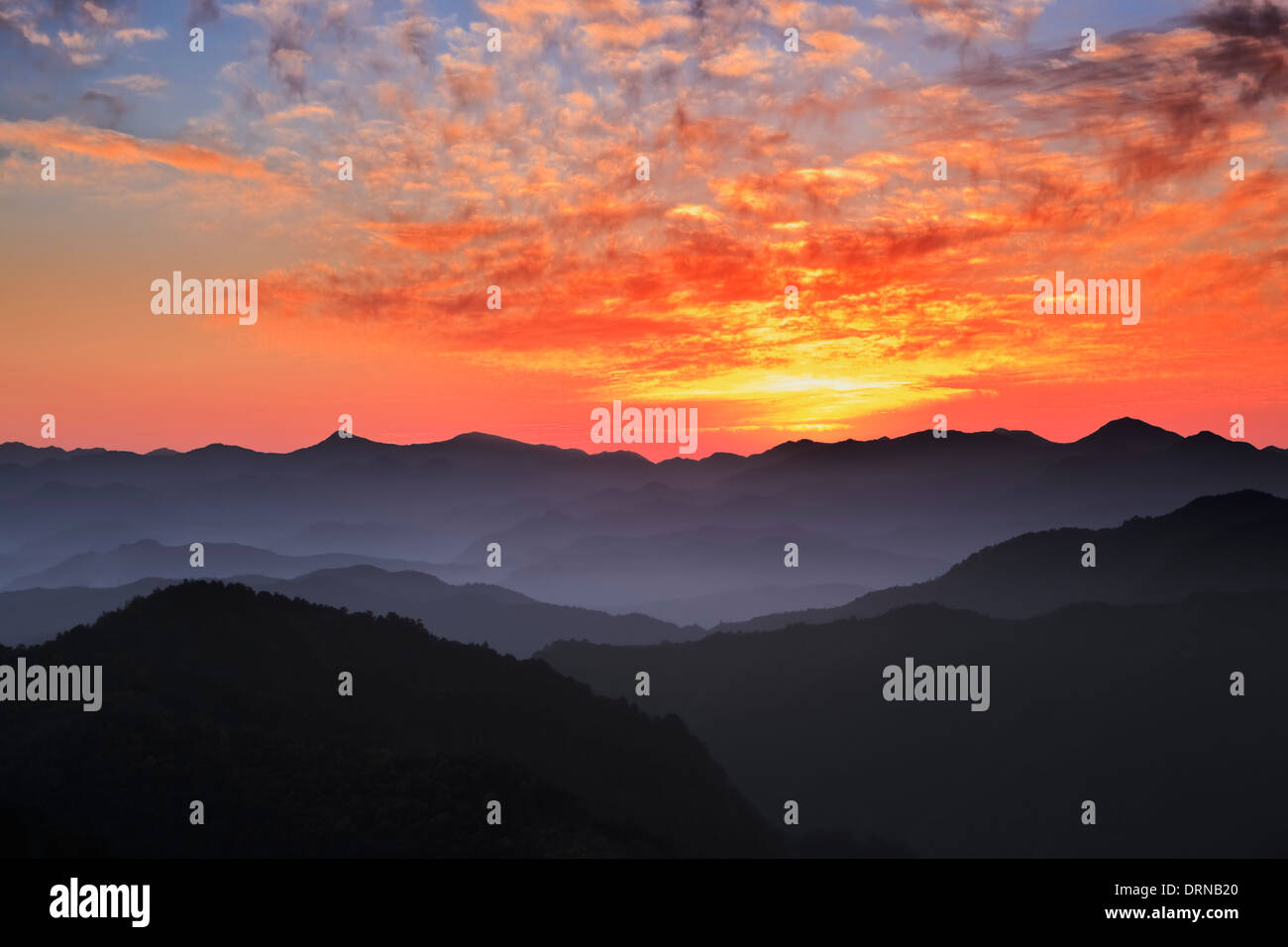 Sunset over The World heritage Kumano and Kii Mountain Range in Japan Stock Photo