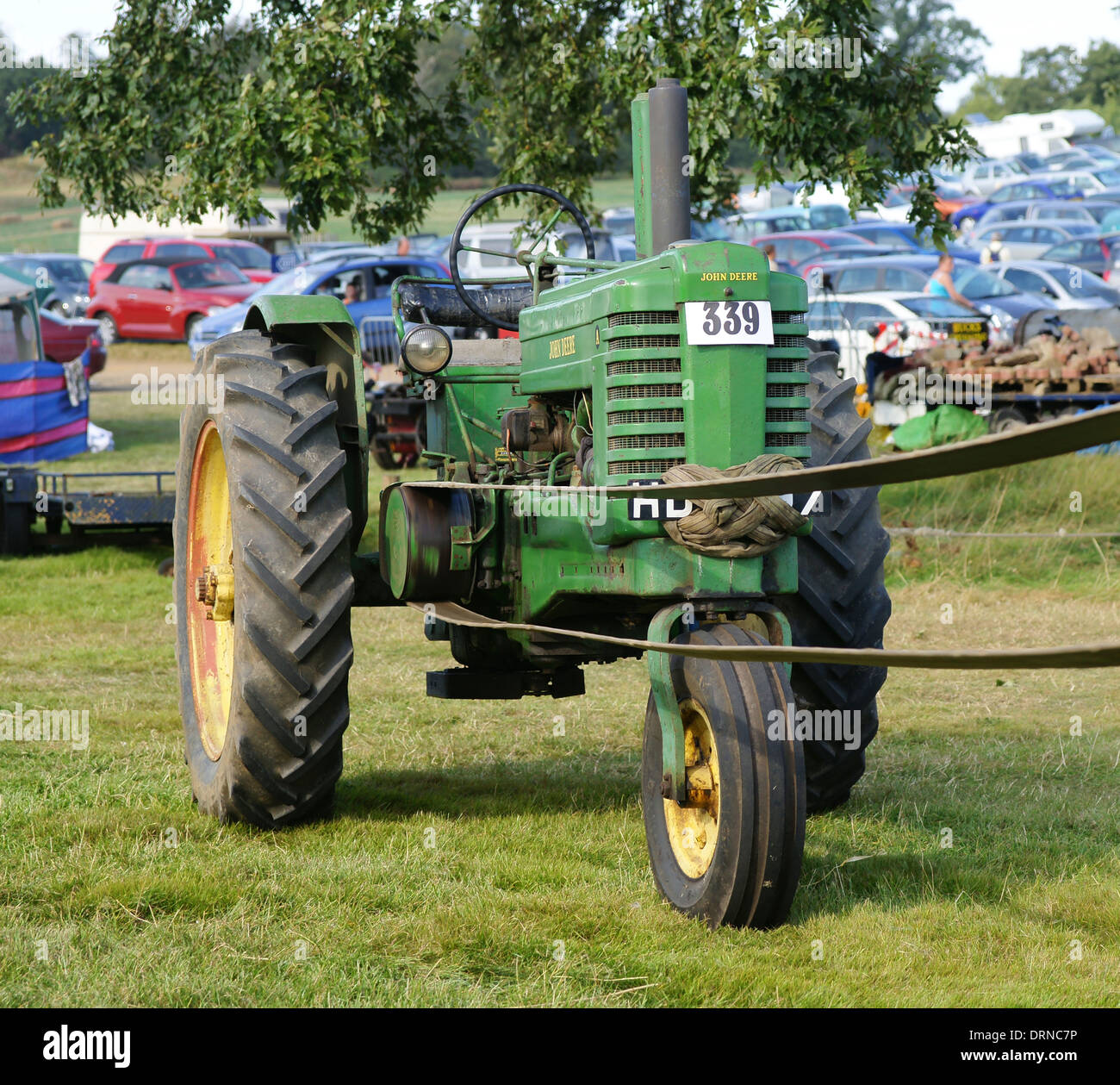 John Deere Model A tractor on belt drive at Bedford steam rally Stock Photo