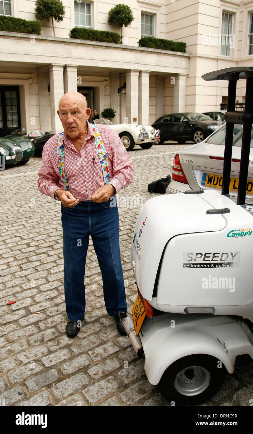 Sir Stirling Moss with braces and scooter in London Stock Photo