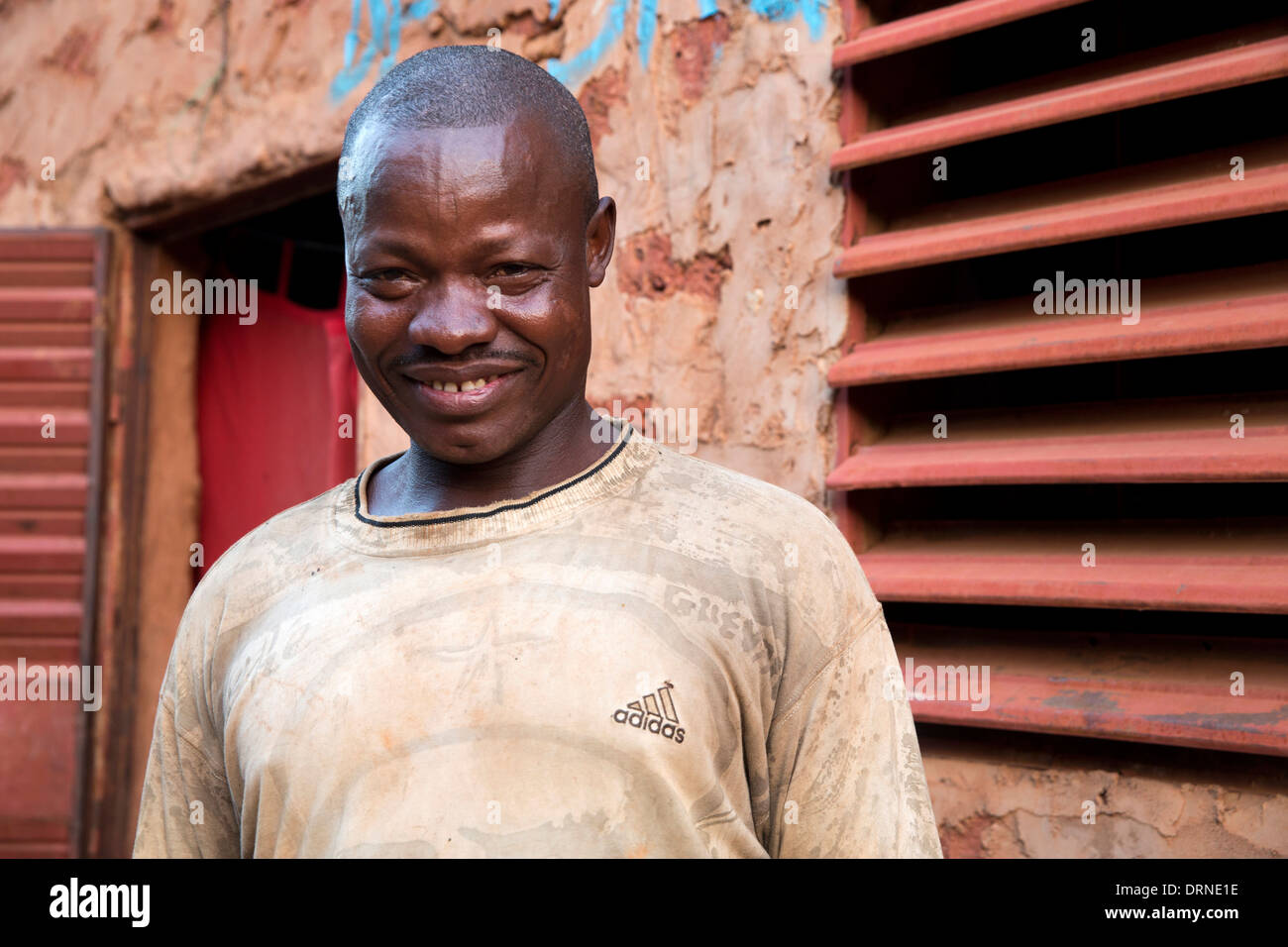 man standing outside home in Bobo Dioulasso, Burkina Faso, Africa Stock Photo