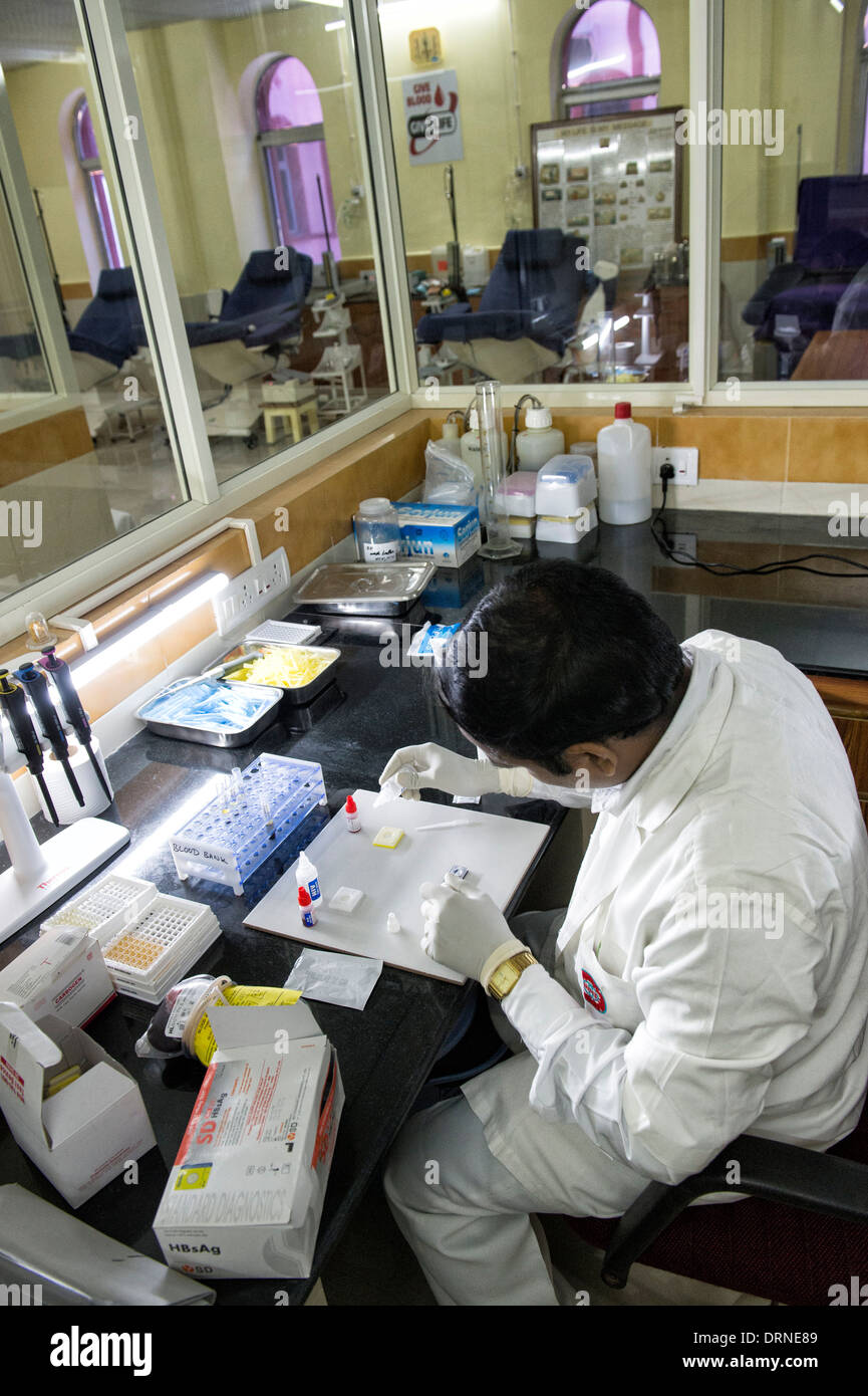 Indian lab technician doing HIV test in the blood bank at Super Speciality hospital. Puttaparthi, Andhra Pradesh, India Stock Photo