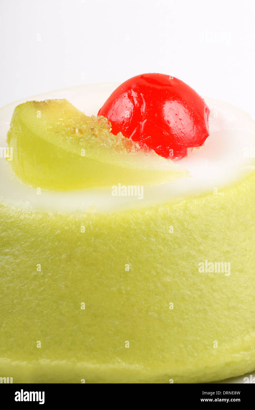 Extreme closeup of a mini sicilian cassata with pieces of candied