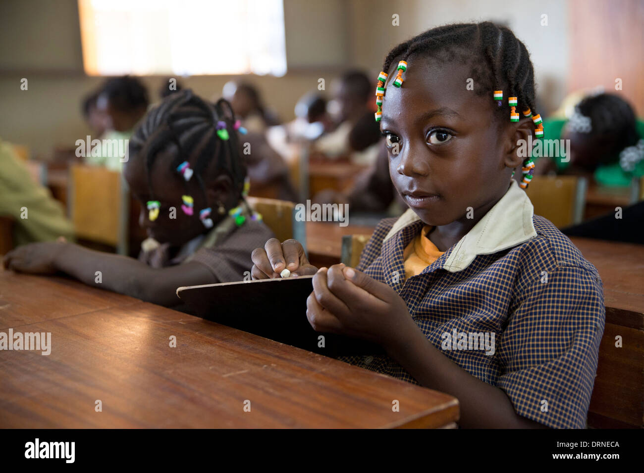 young girl in classroom of church supported school in Bobo Dioulasso, Burkina Faso, Africa Stock Photo